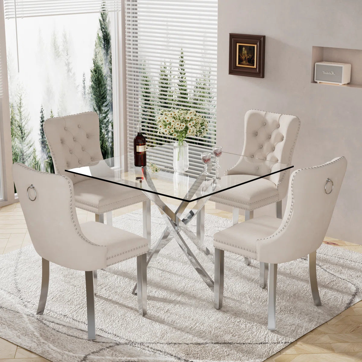 5-piece dining set with thick tempered glass table and cream, Black, grey velvet chairs featuring tufted backs, nailhead trim, and chrome legs.