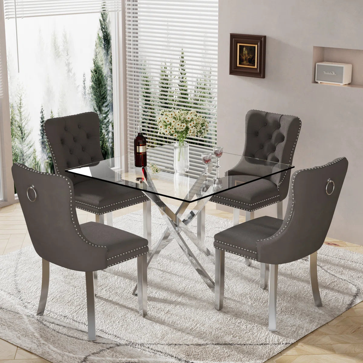 5-piece dining set with thick tempered glass table and cream, Black, grey velvet chairs featuring tufted backs, nailhead trim, and chrome legs.