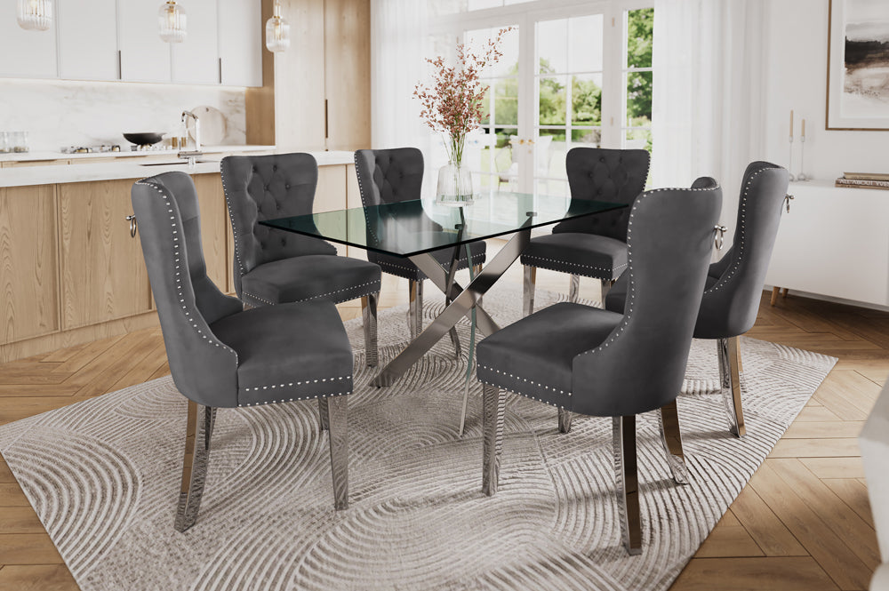 7-piece dining set with thick tempered glass table and cream, Black, grey velvet chairs featuring tufted backs, nailhead trim, and chrome legs.