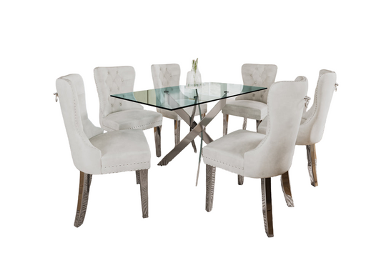 7-piece dining set with thick tempered glass table and cream, Black, grey velvet chairs featuring tufted backs, nailhead trim, and chrome legs.